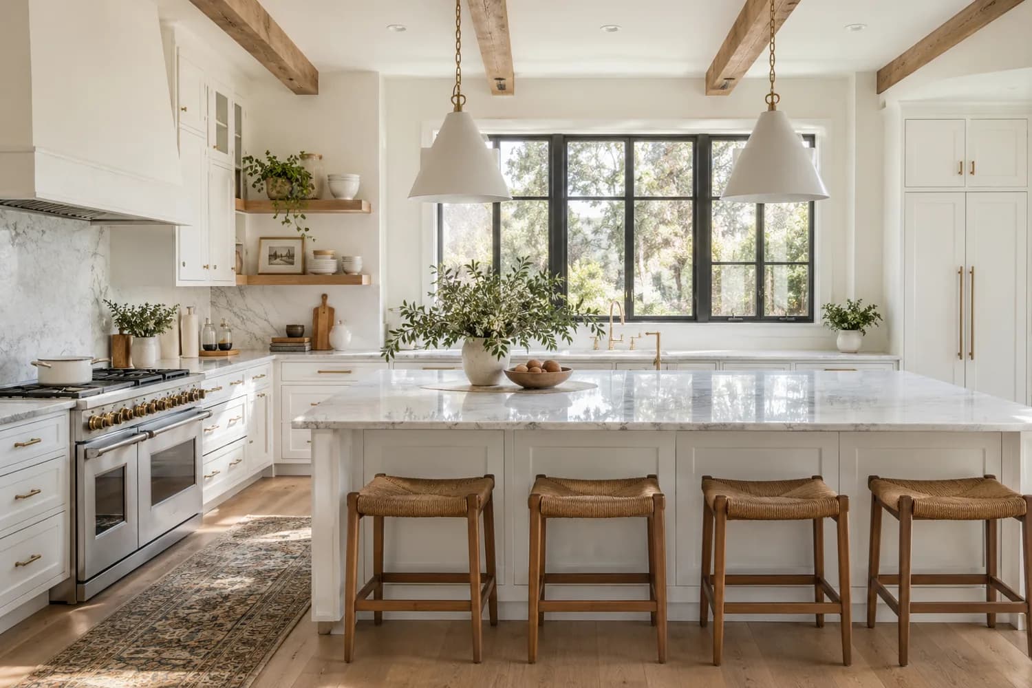 A bright kitchen with white painted cabinetry and walls